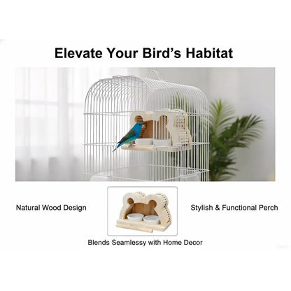 A white metal bird cage with a small blue-and-yellow bird perched inside, shown on a light background with text reading 'Elevate Your Bird's Habitat' and a smaller inset of a natural wood perch labeled 'Natural Wood Design' and 'Stylish & Functional Perch.'.