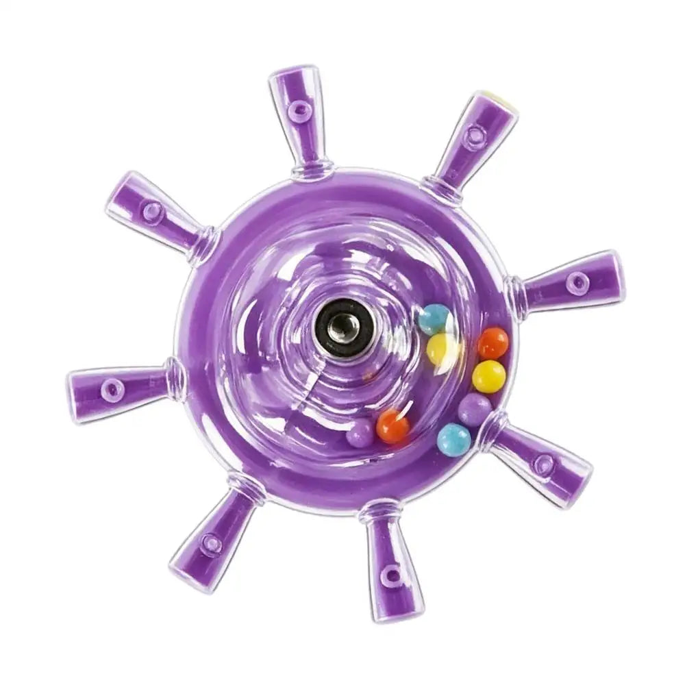 A purple translucent toy wheel with six radiating spokes and several small colorful beads inside, shown on a plain white background.