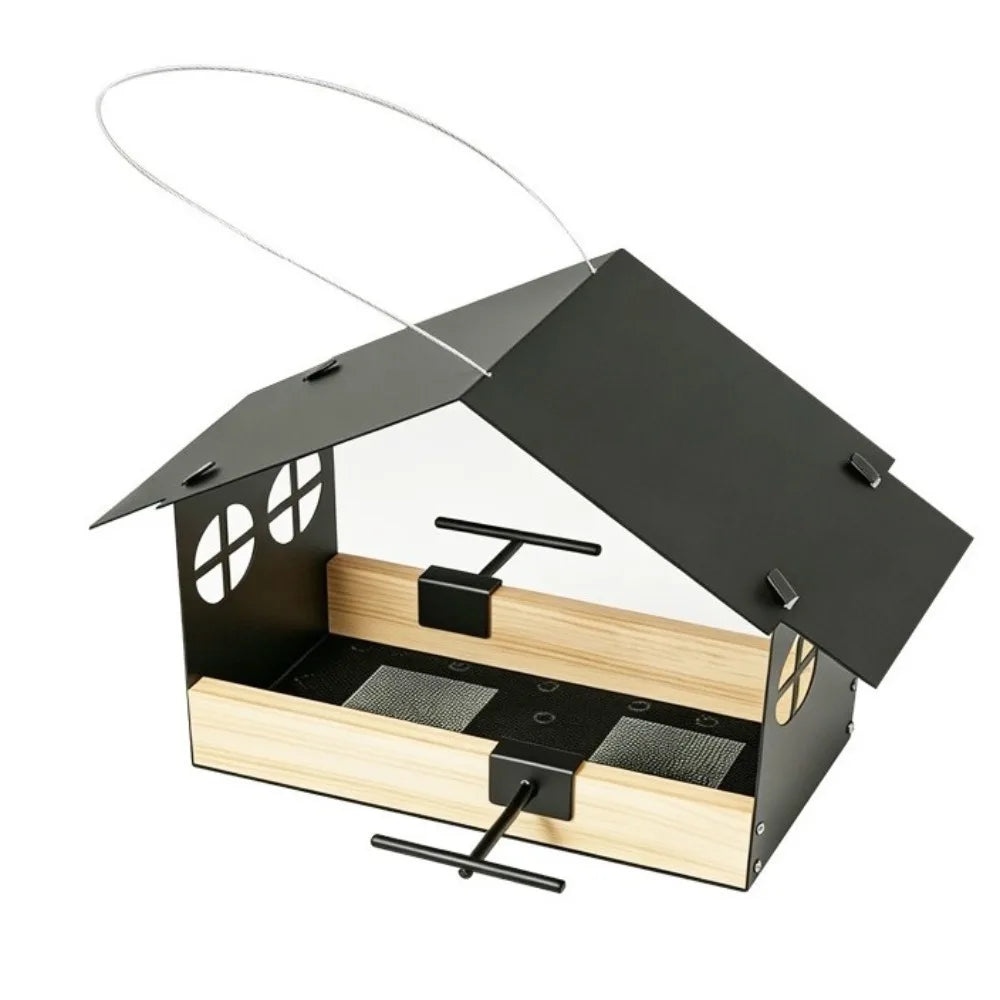 A house-shaped bird feeder with a black metal frame and roof, light natural wood sides, and a clear front panel, shown on a white background with a hanging wire perch above.