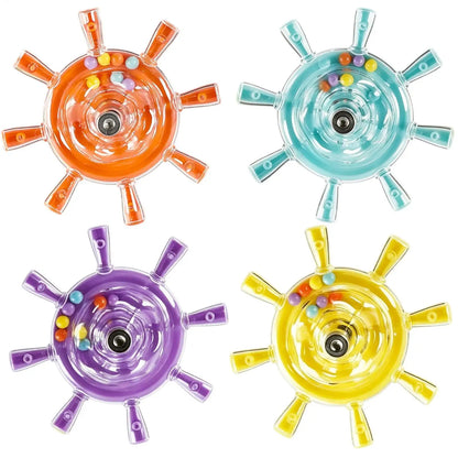 Four translucent ship wheel-shaped toy knobs in orange, light blue, purple, and yellow, each with small multicolored beads inside, arranged on a white background.