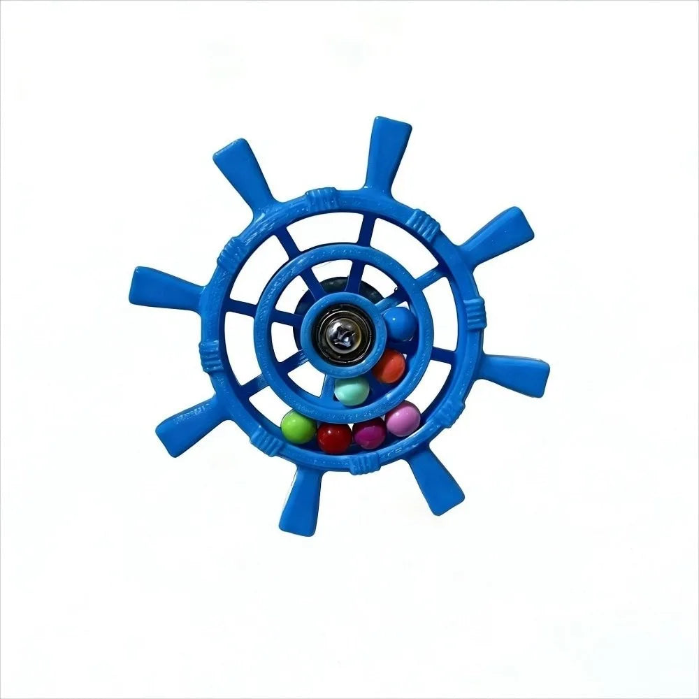 A blue ship's wheel-shaped fidget toy with a central metal bearing and small colorful beads inside, shown on a plain white background.