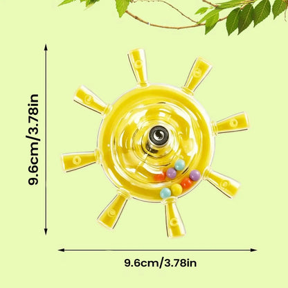 A yellow transparent circular bird toy measurement arrows and text indicating 9.6 cm / 3.