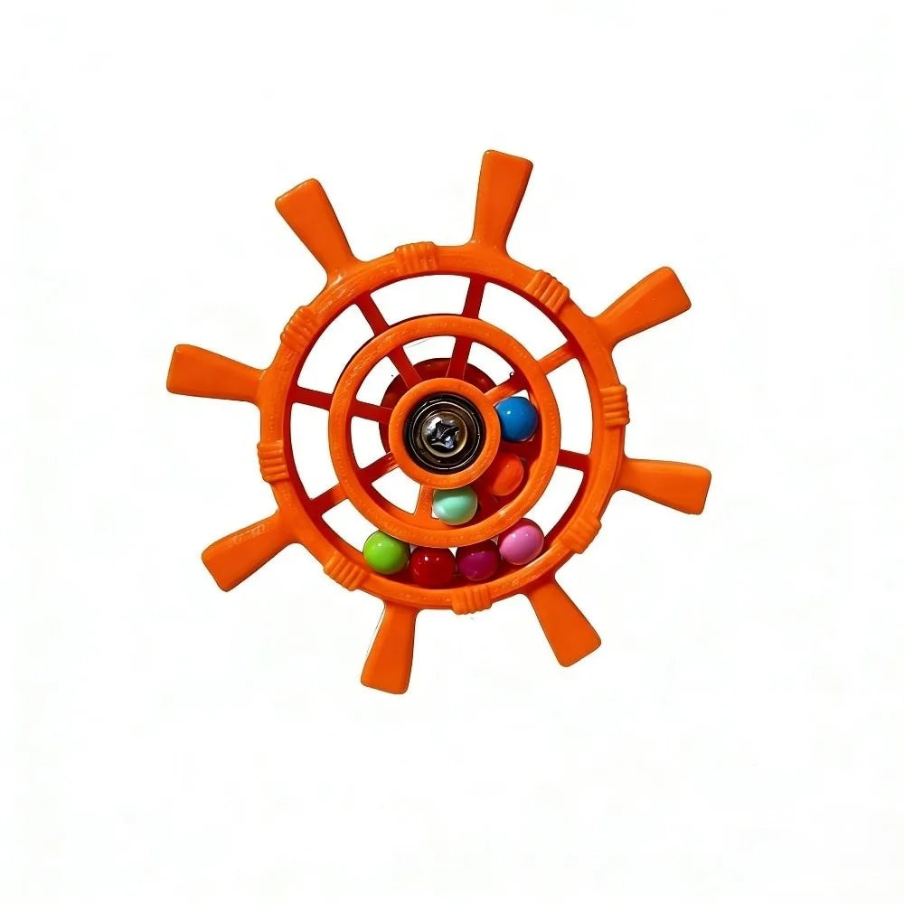 An orange plastic ship's wheel toy with colorful beads inside, shown on a plain white background.