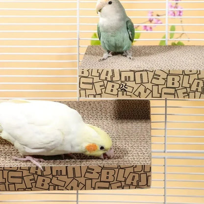 Two small birds perched on a cardboard platform inside a cage. 