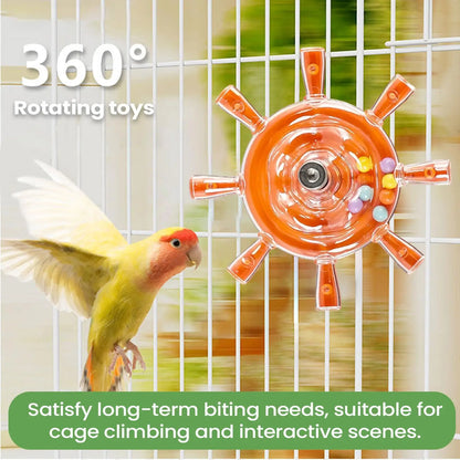 Orange rotating toy for birds in a cage with a parrot perched on the side.