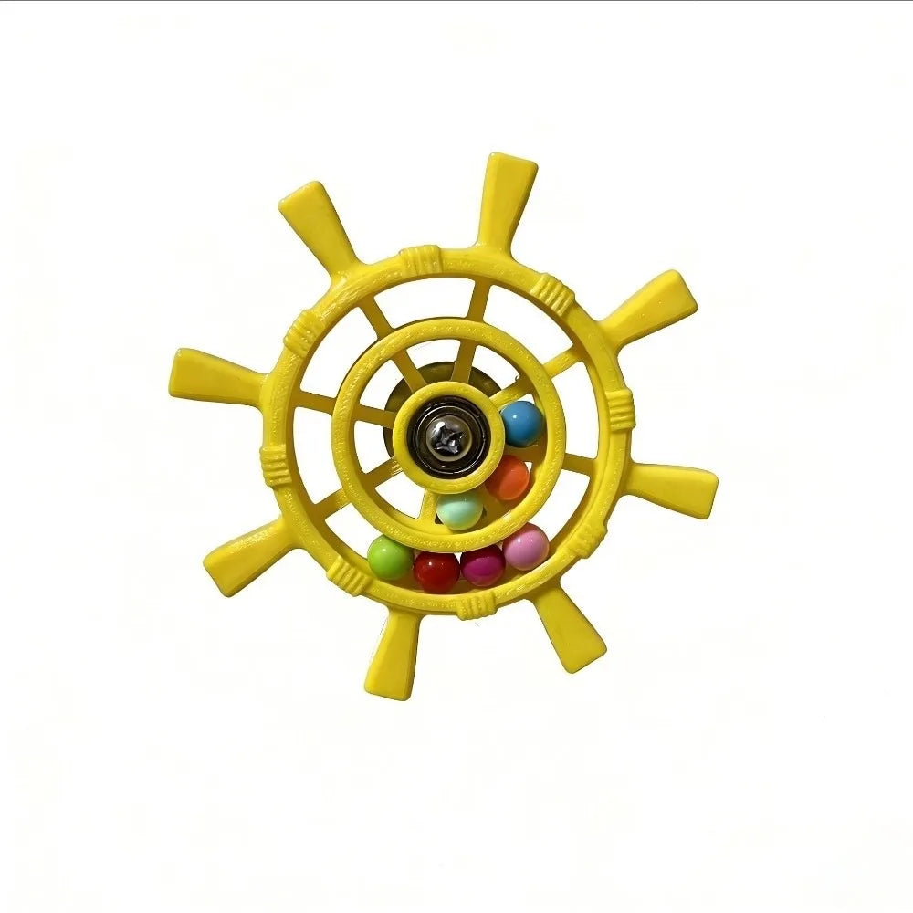 A yellow ship's wheel fidget toy with colorful beads inside, shown on a plain white background.