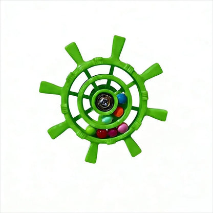 A green ship's wheel toy with colorful plastic beads inside, shown on a plain white background.